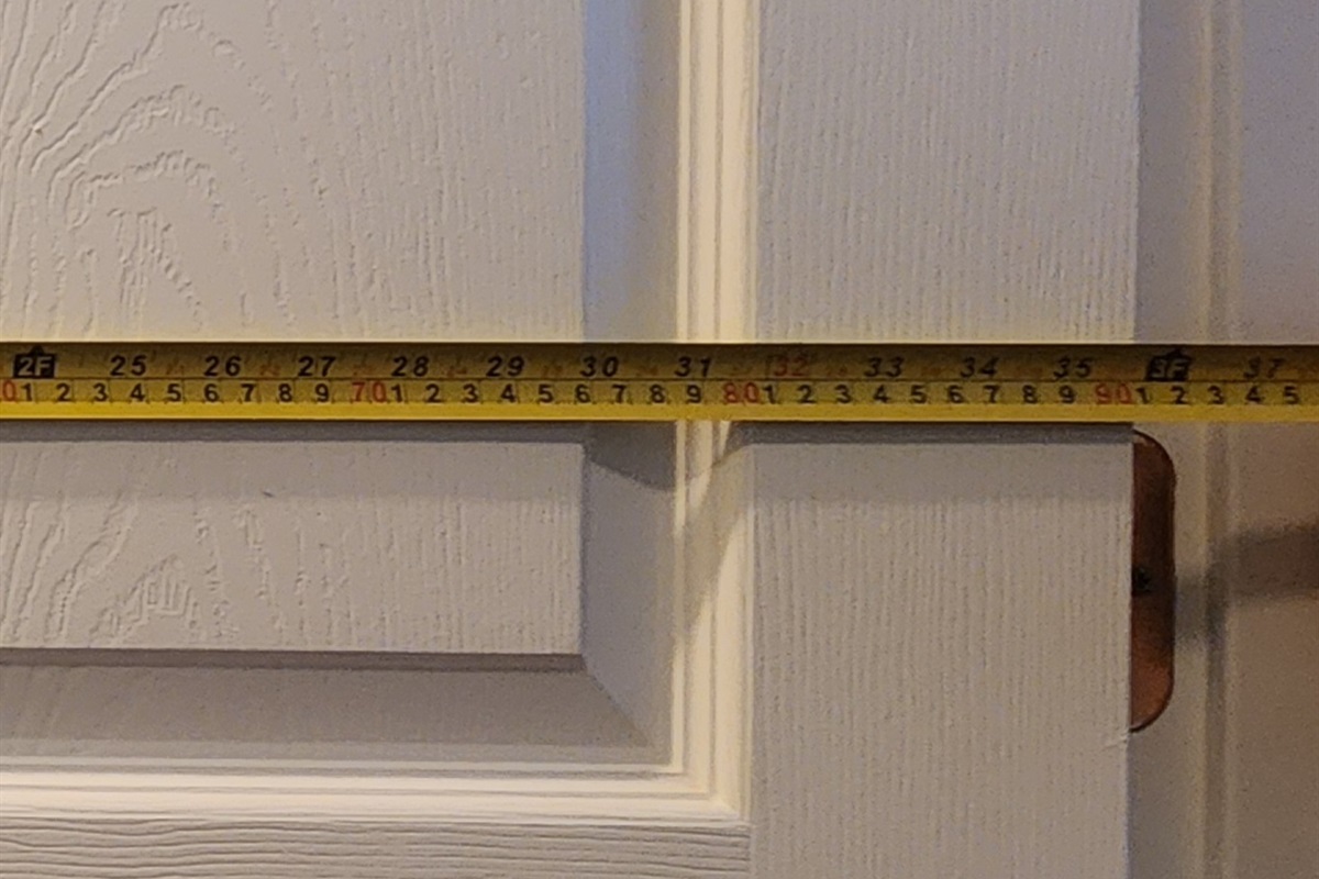 Close-up showing door width measurement exceeding 32 inches