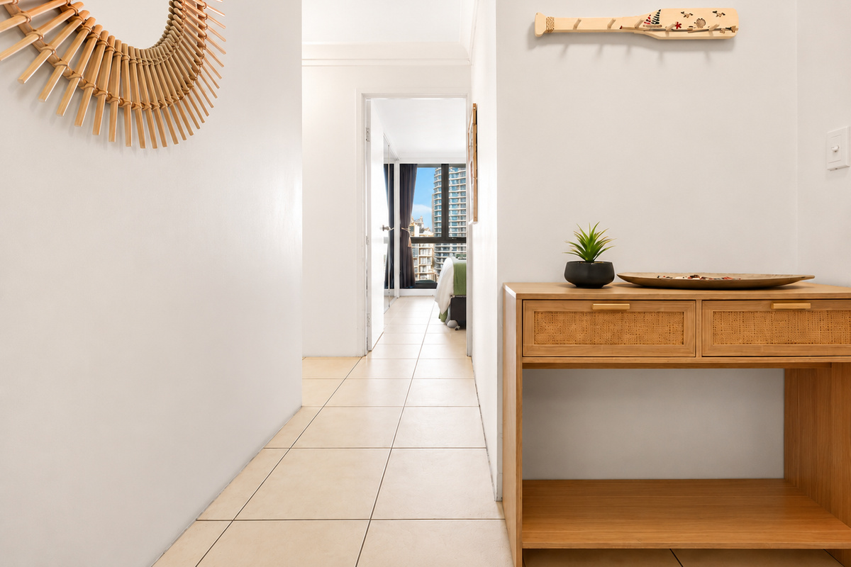 The entry hallway at Robin's Paradise sets up your Surfers Paradise stay, leading through to the bedrooms and high-rise Gold Coast outlooks.