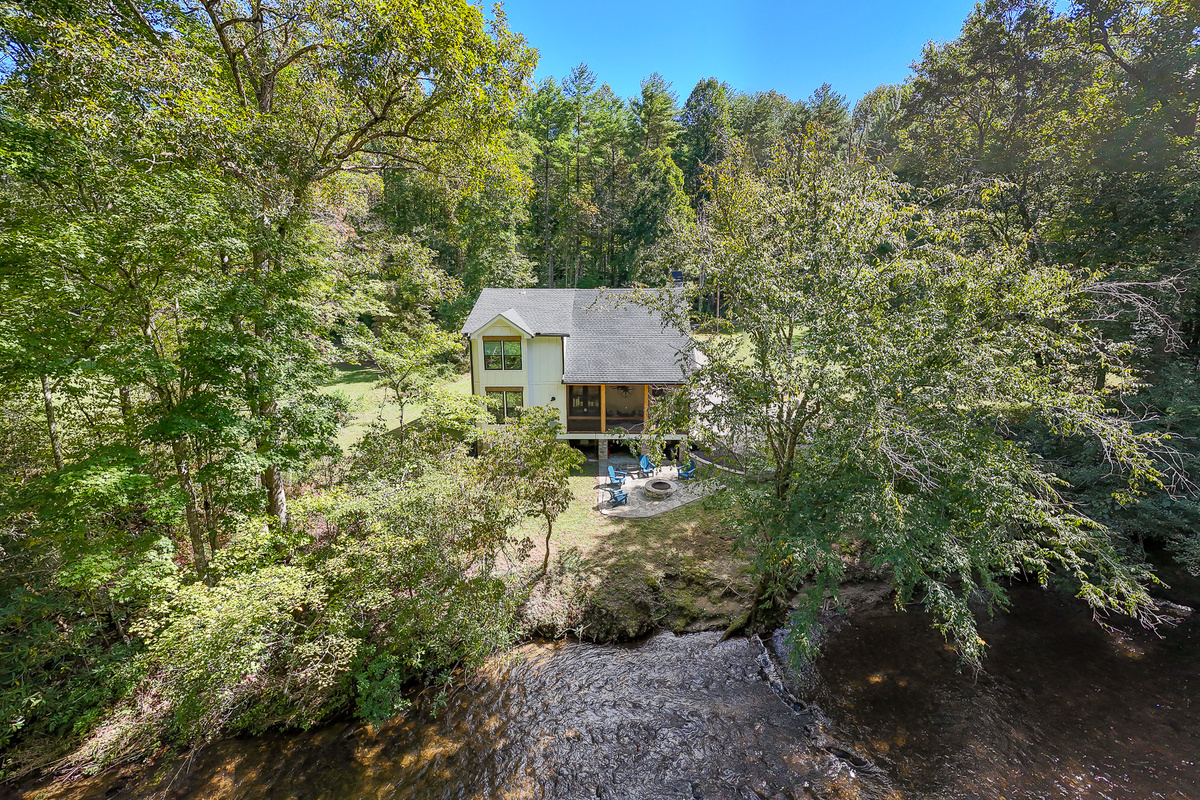 Tucked among the trees, Robbin’s Nest on Snowbird Creek offers a peaceful setting with a creekside fire pit for evenings outdoors.