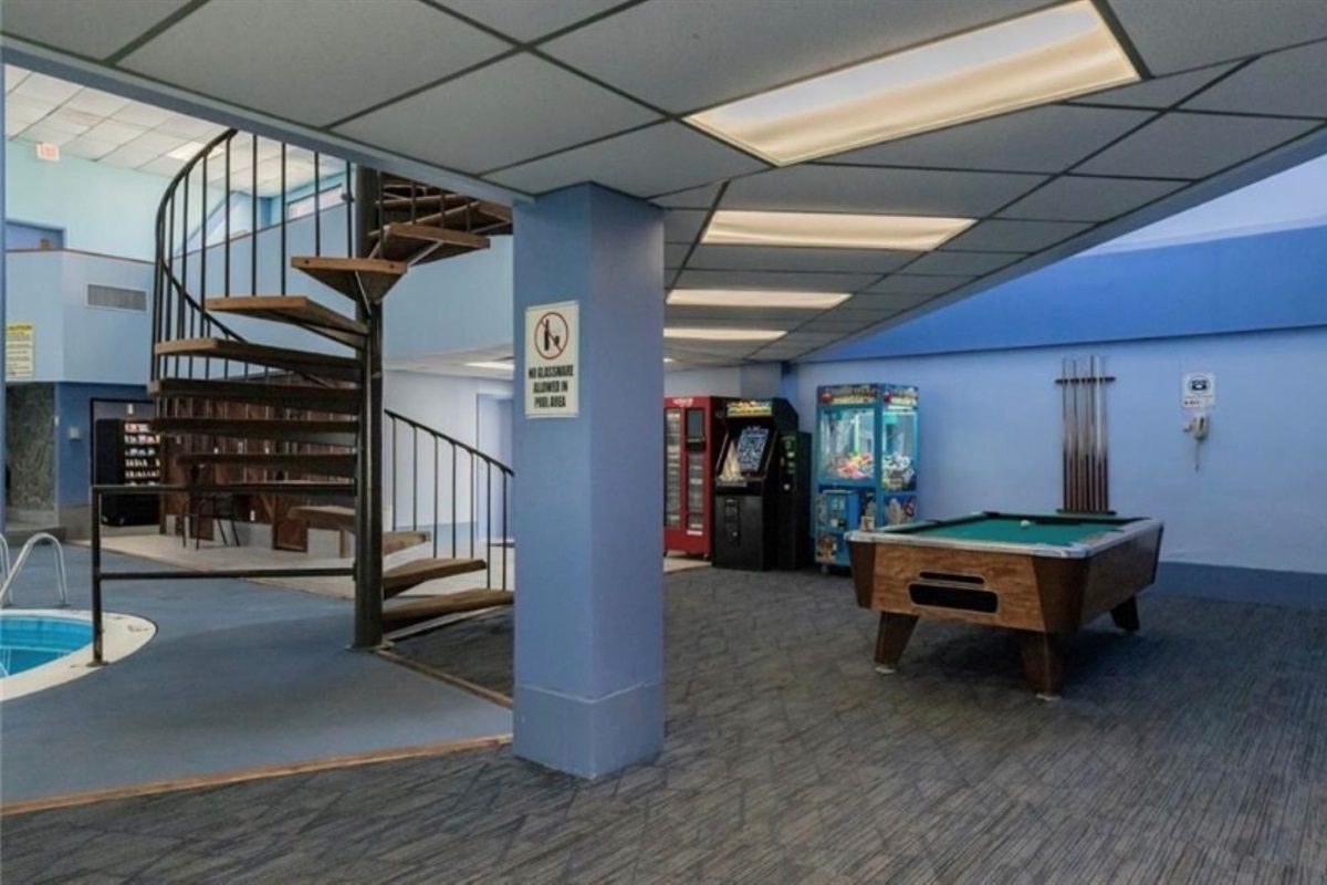 Game room with pool table, ping pong, and electronic games