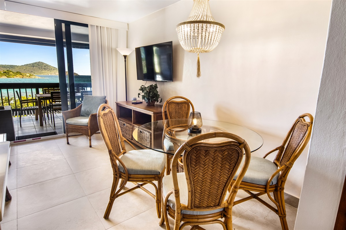 Cozy dining area with seating for four&mdash;ideal for meals, games, or morning coffee.