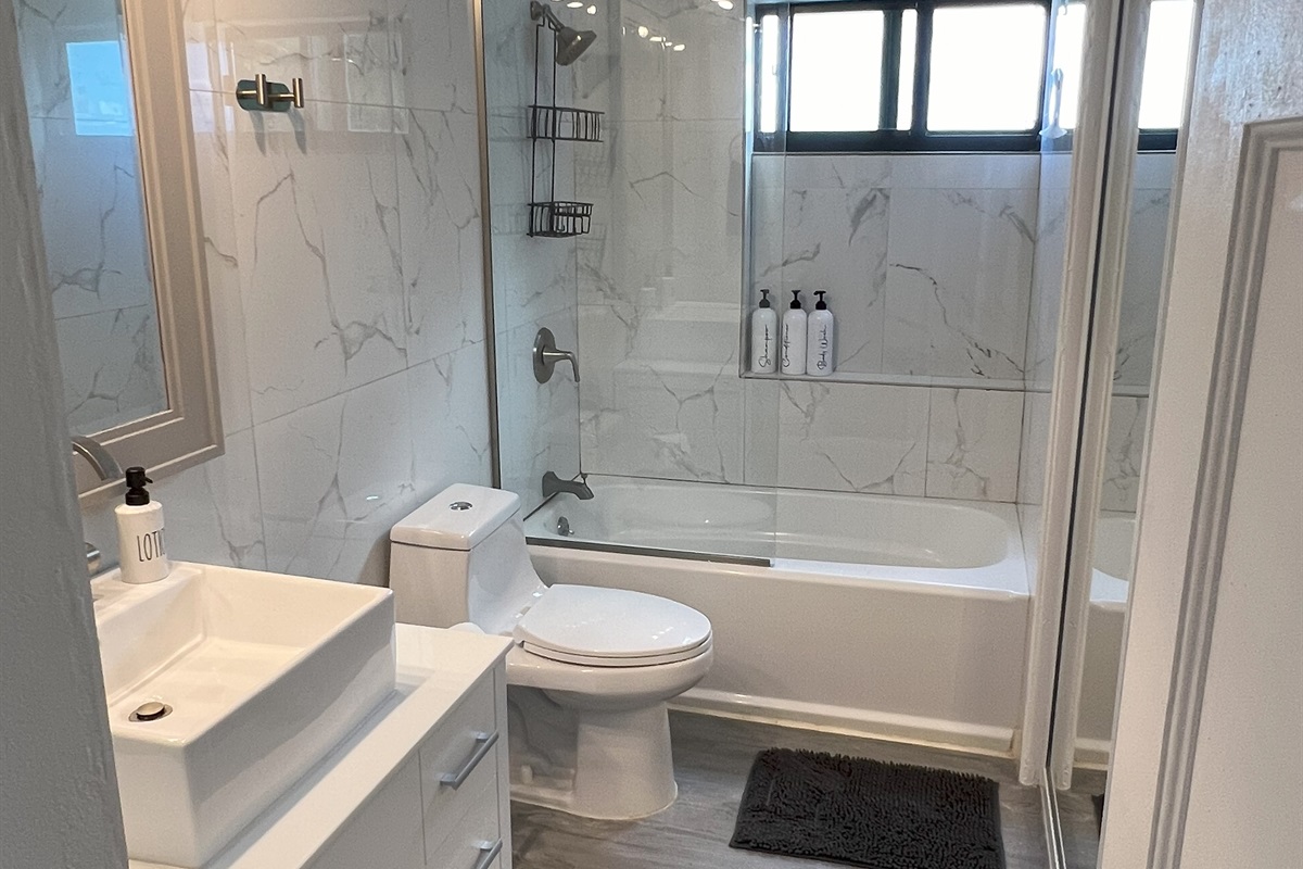 This bathroom is located at the top of the stairs, between the bedrooms. But remember, there is another full bathroom at the bottom of the stairs.