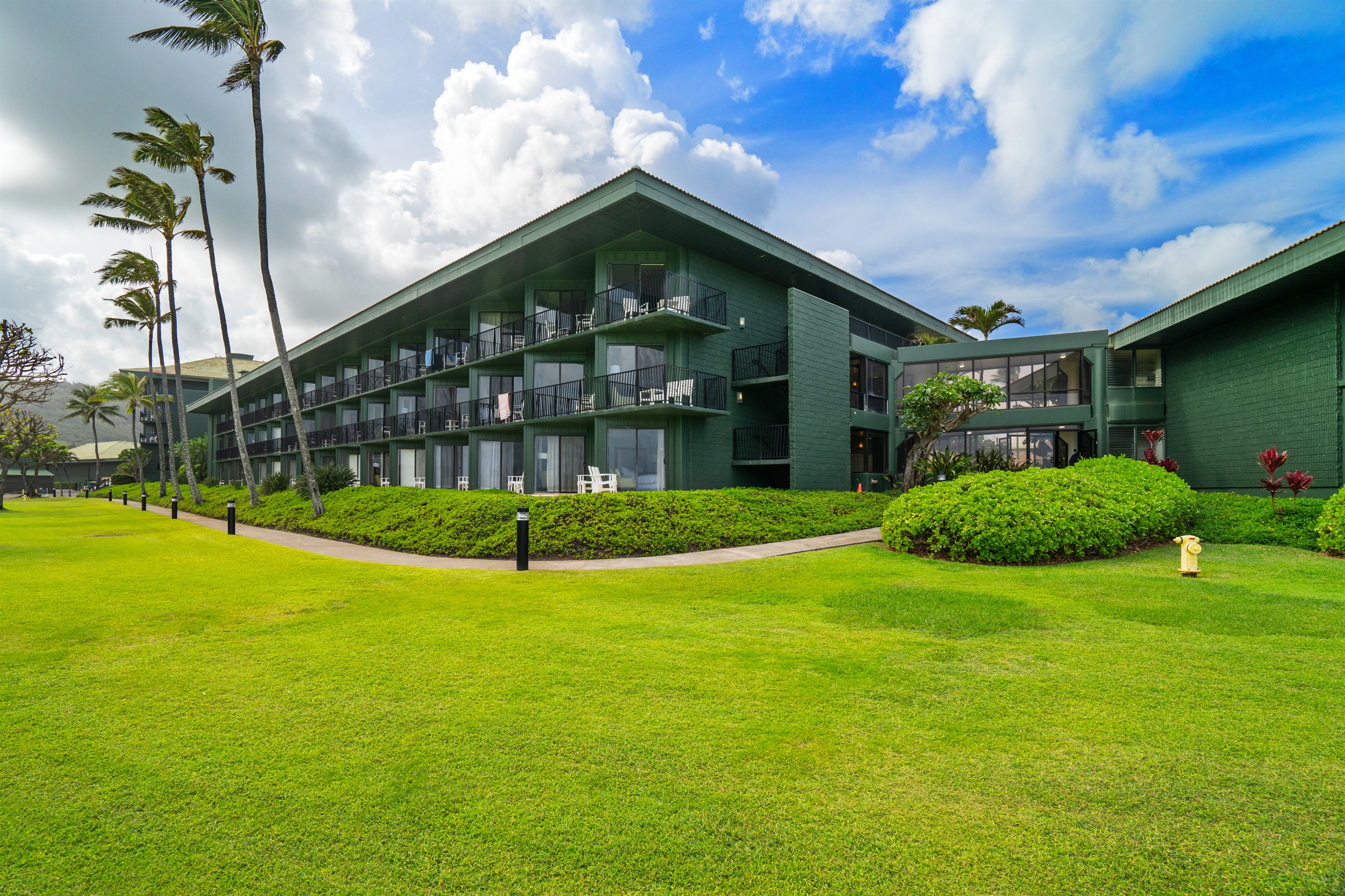 Lush resort grounds in a central Kauai location—close to hikes, waterfalls, and beaches.