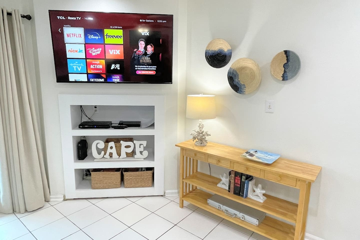 Find the Smart TV at the top of the stairs doing double duty &mdash; catch the game or stream, your call.