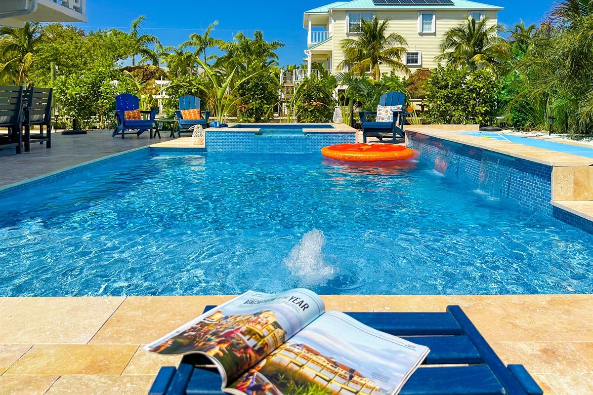 Take a refreshing dip in the pool with a waterfall feature.