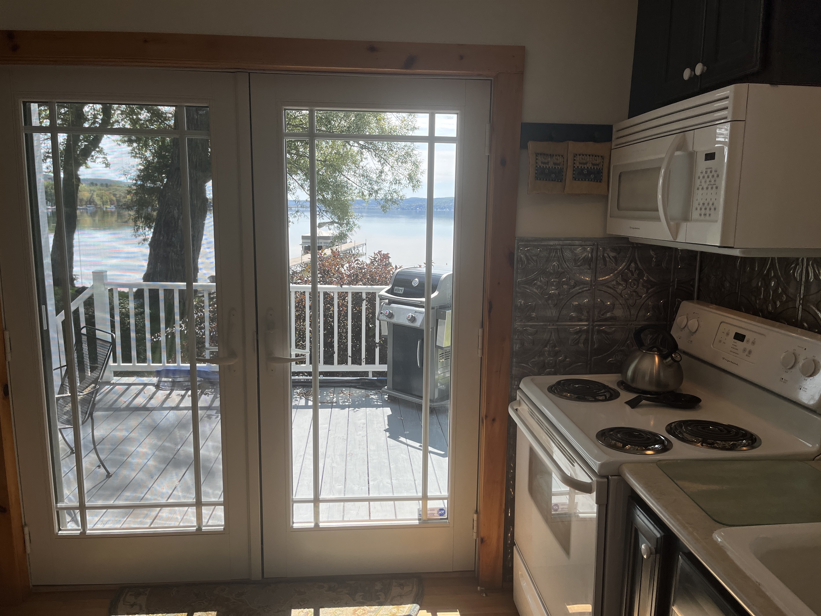 Kitchen with deck beyond, easy access to the grill