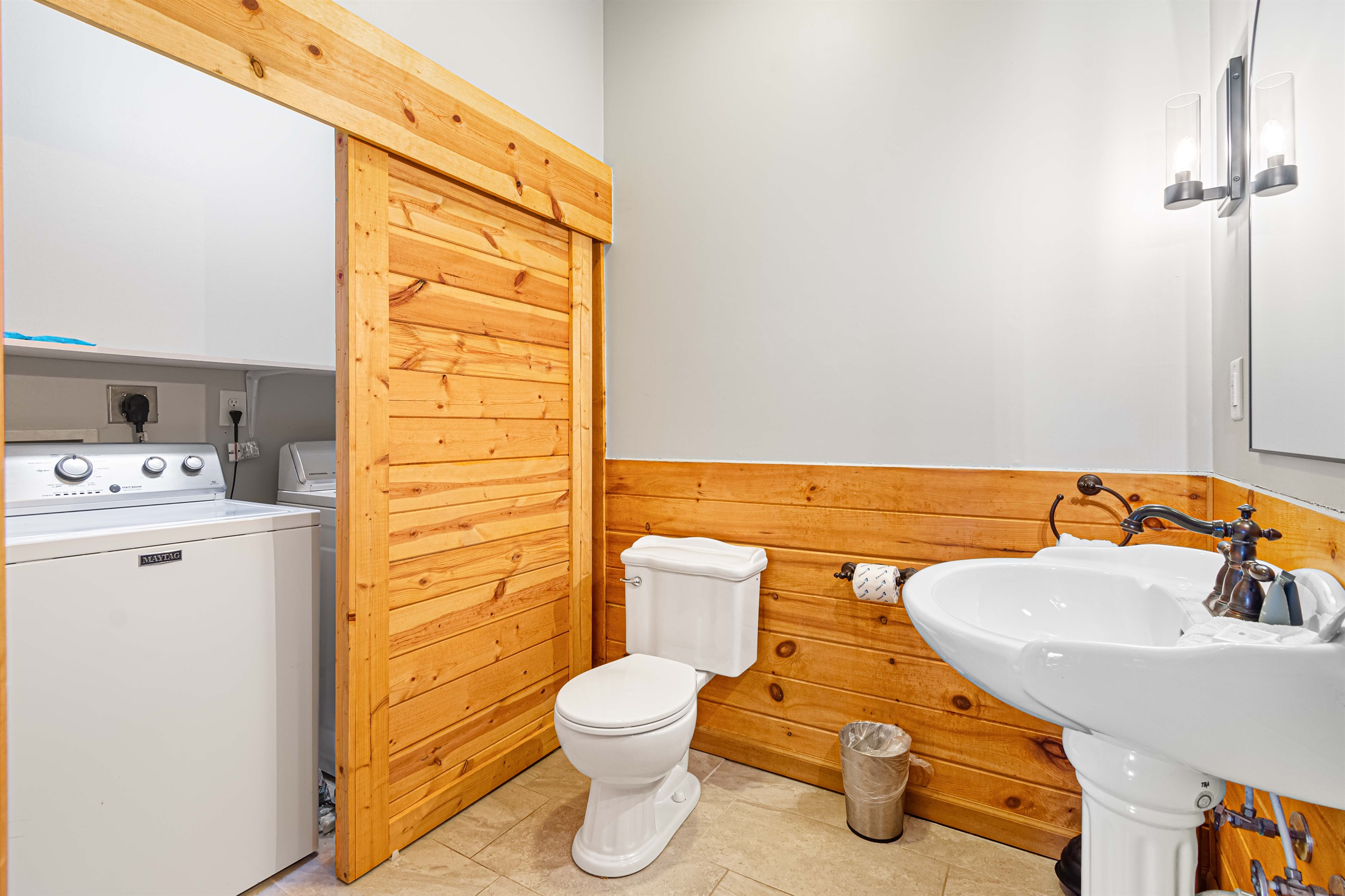 Large capacity washer and dryer in the half bath off the game room.