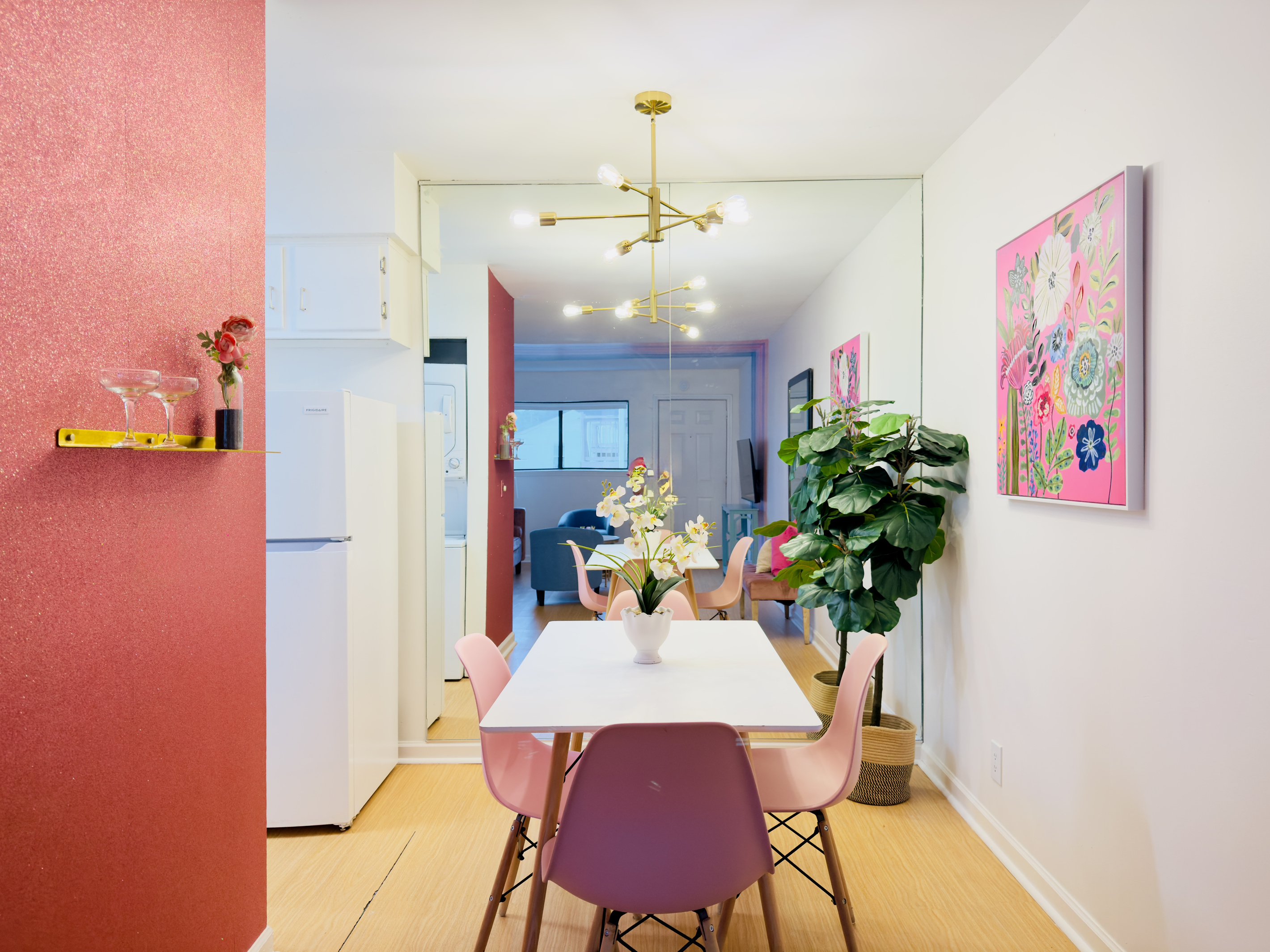 Dining for 4 and with a full wall mirror,
