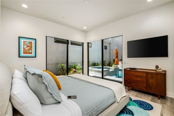 First Floor Primary Bedroom and Pool Area