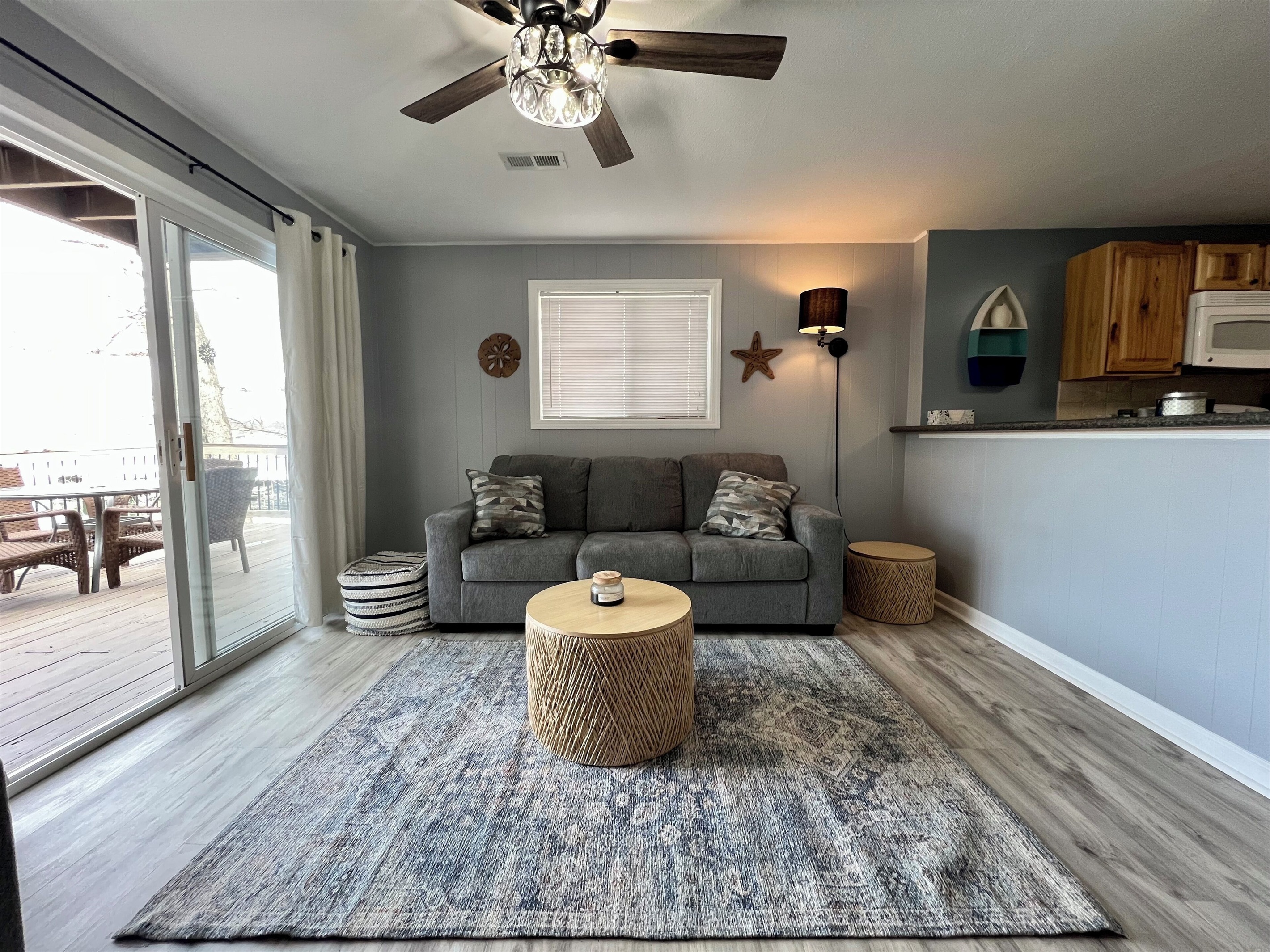 Living Room with queen sleeper sofa. Walk out to the deck and view our cove.