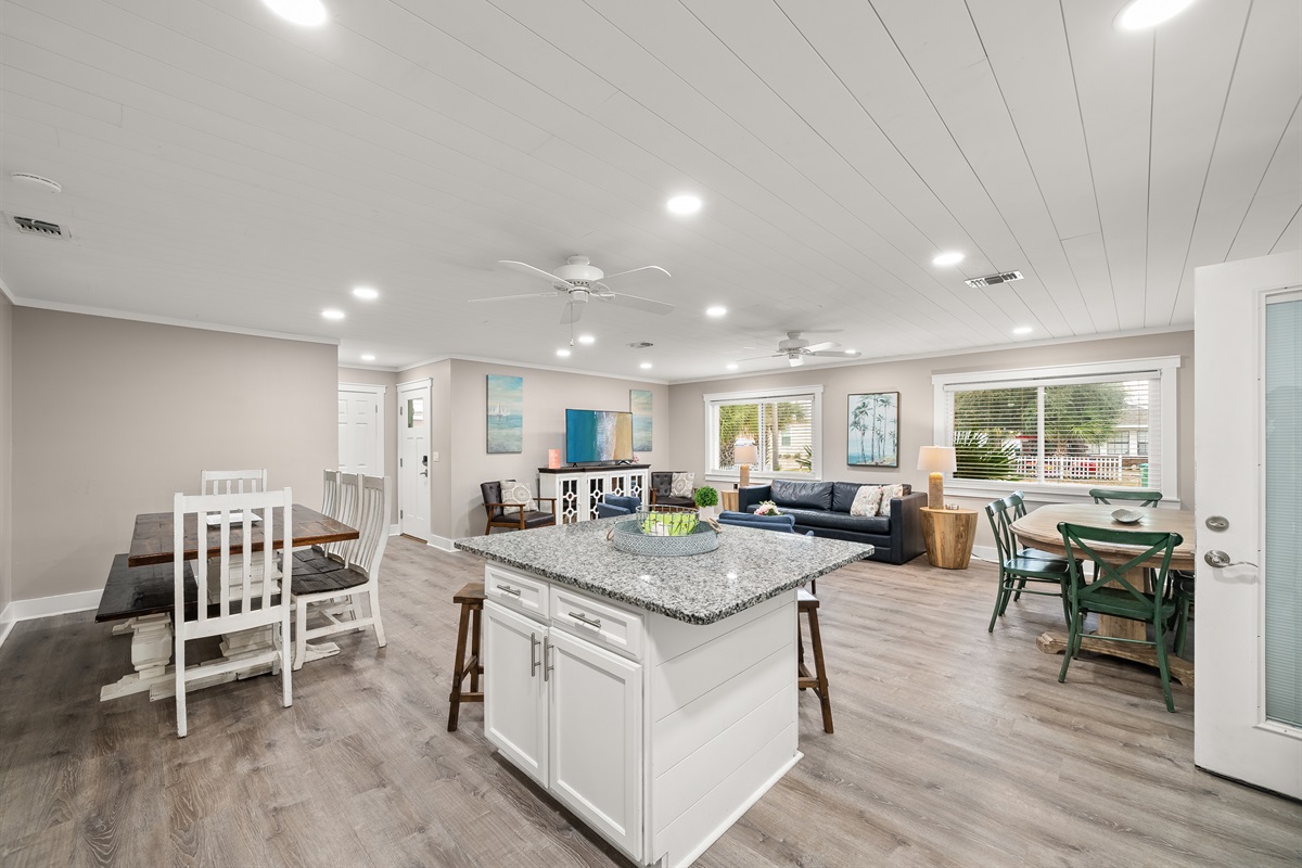 As you walk through the front door, to your left at the front of the house is the keeping room. There is an open concept kitchen/dining/living space large enough for all to gather.
