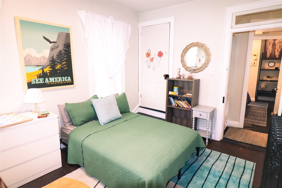 cozy twin over twin bunk with a full bed makes this family friendly bedroom