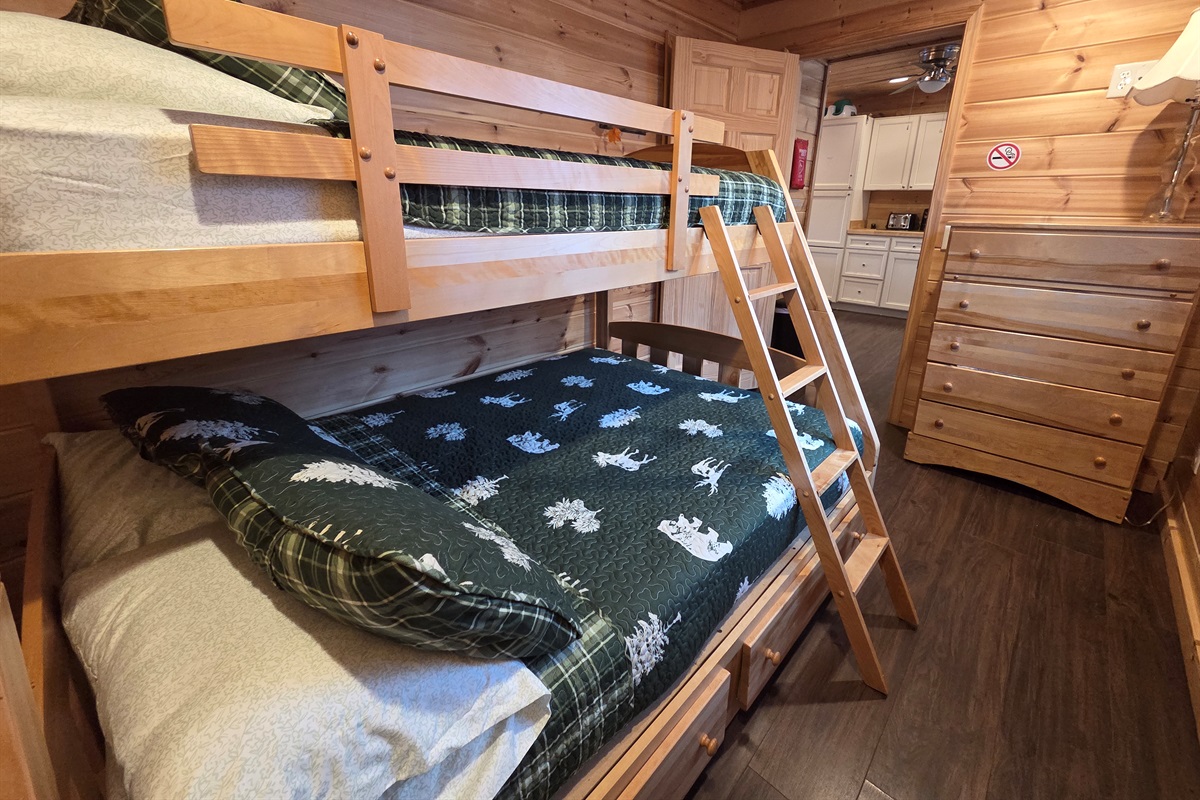 The main-level third bedroom offers a bunk bed with a full-size bed on the bottom and a twin on top, perfect for kids or extra guests.