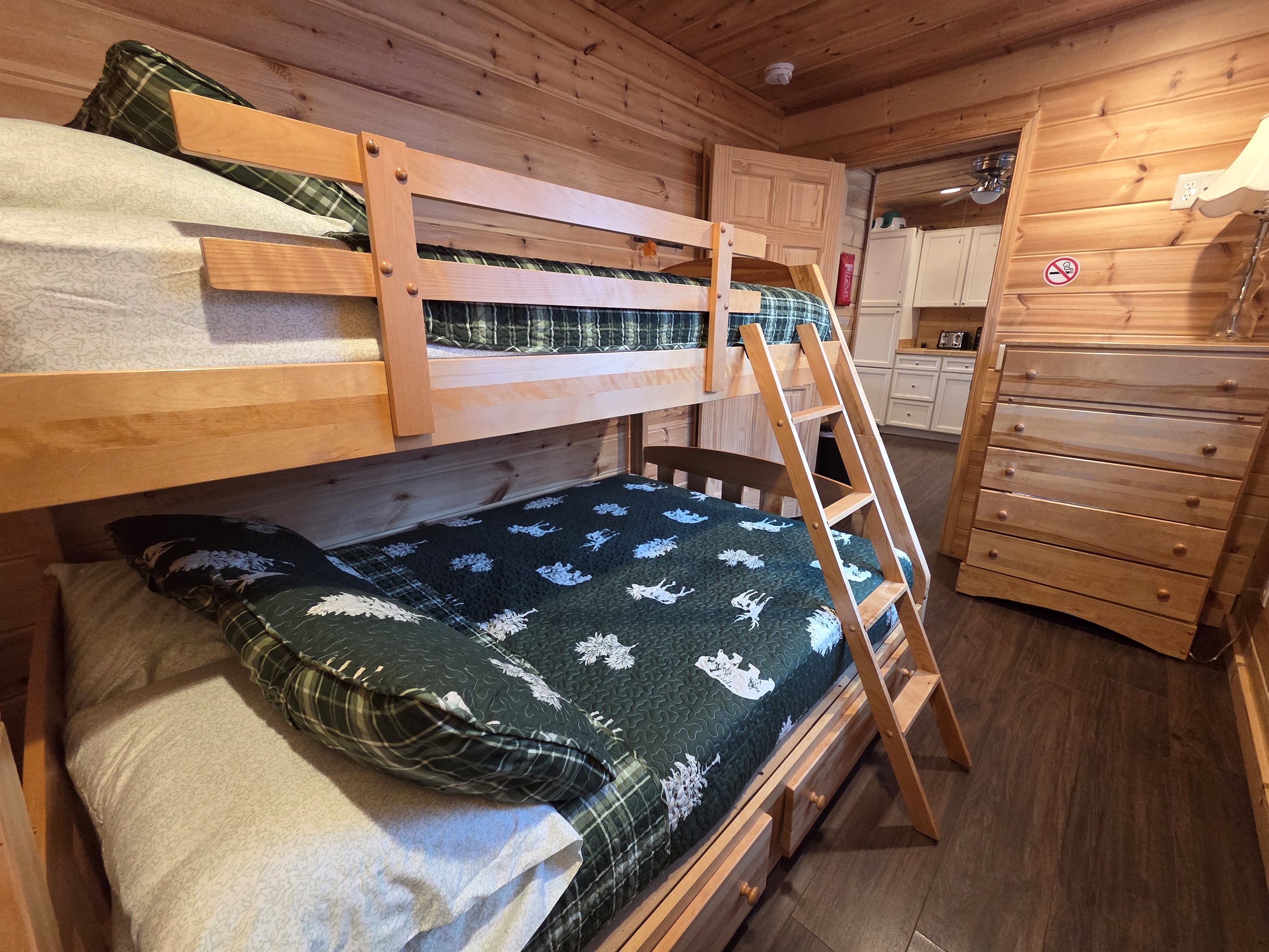 The main-level third bedroom offers a bunk bed with a full-size bed on the bottom and a twin on top, perfect for kids or extra guests.
