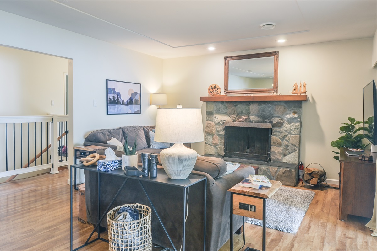 Cozy living room with real brick fireplace — firewood included 