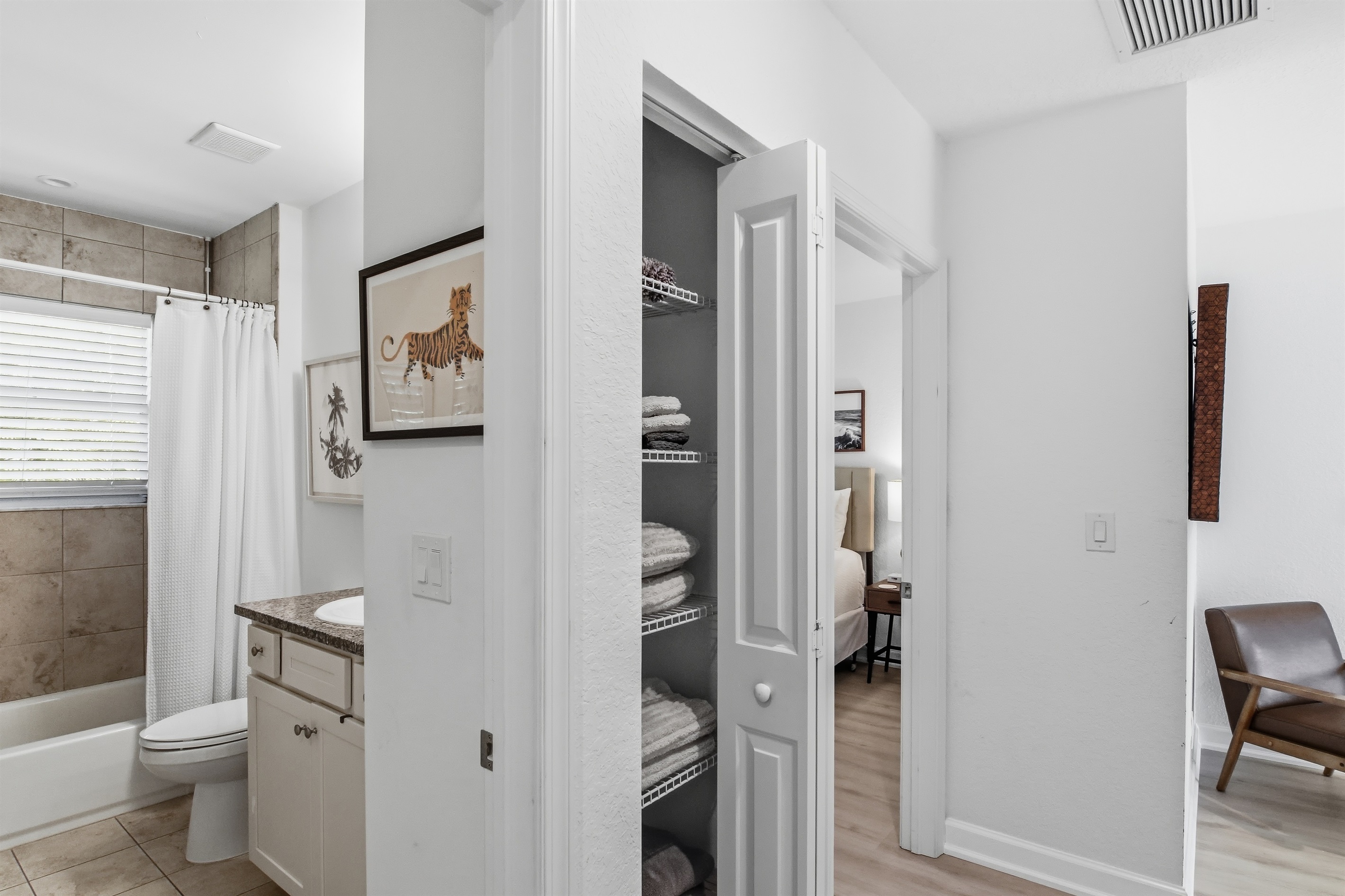 Upstairs hallway, shared bath and linen closet for king and queen bedrooms