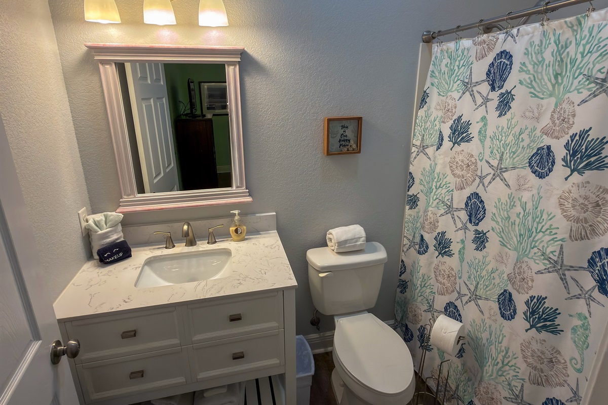 Ensuite Bathroom 4 is designed with comfort in mind, offering a spacious vanity area and a tub and shower combo perfect for rinsing off after beach days.