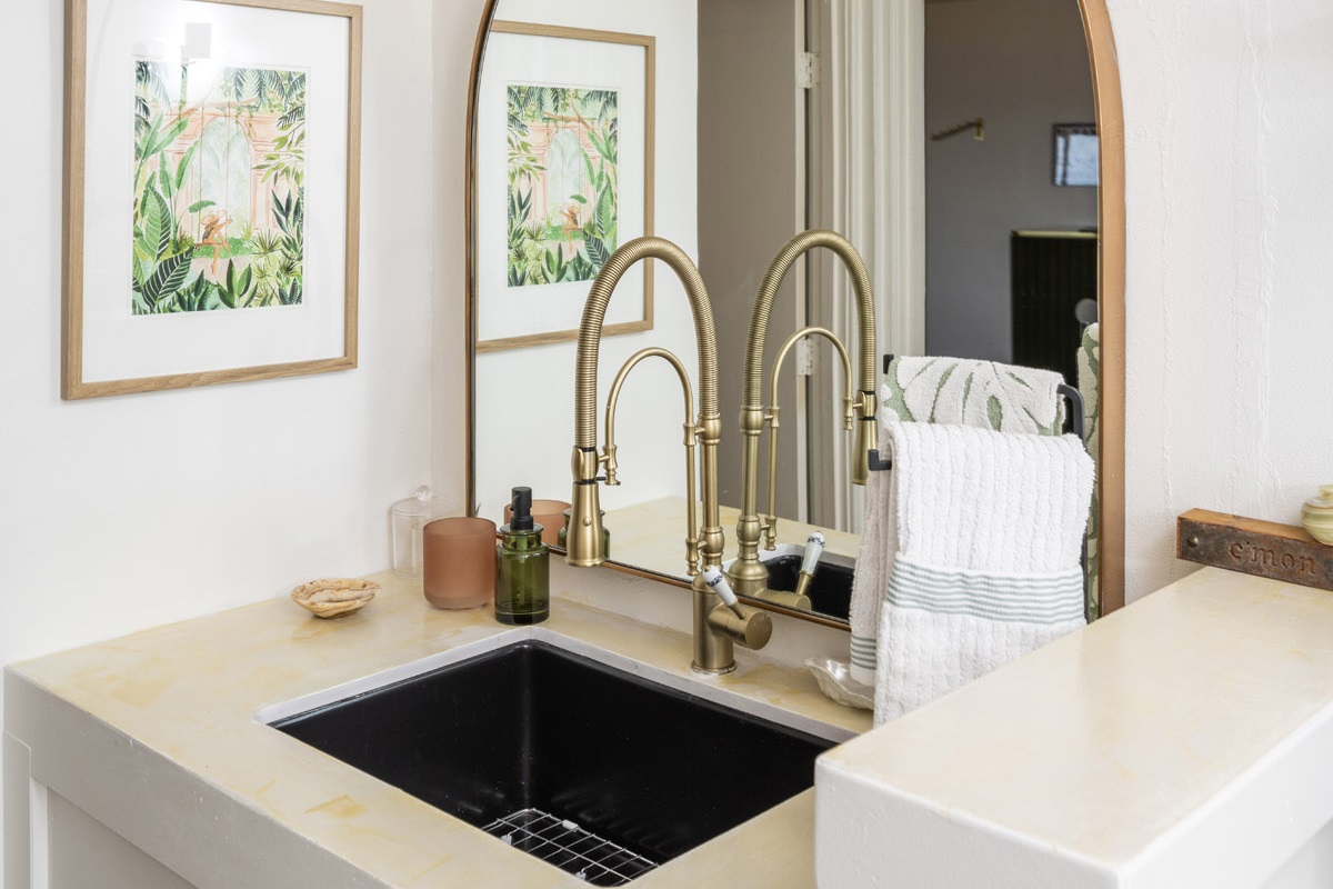 Modern vanity area with dual sinks and plenty of counter space.