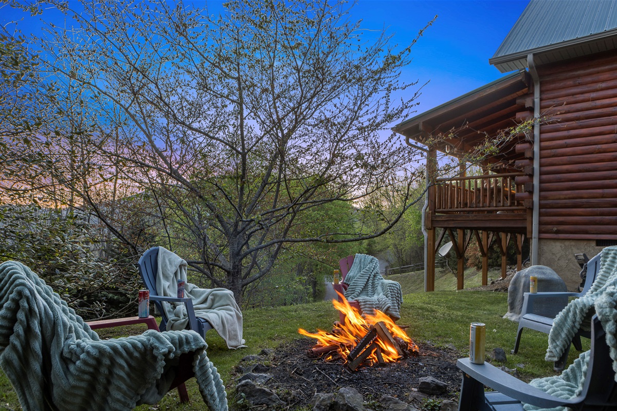Fire Pit Retreat: Unwind under the stars by the crackling fire with drinks in hand!