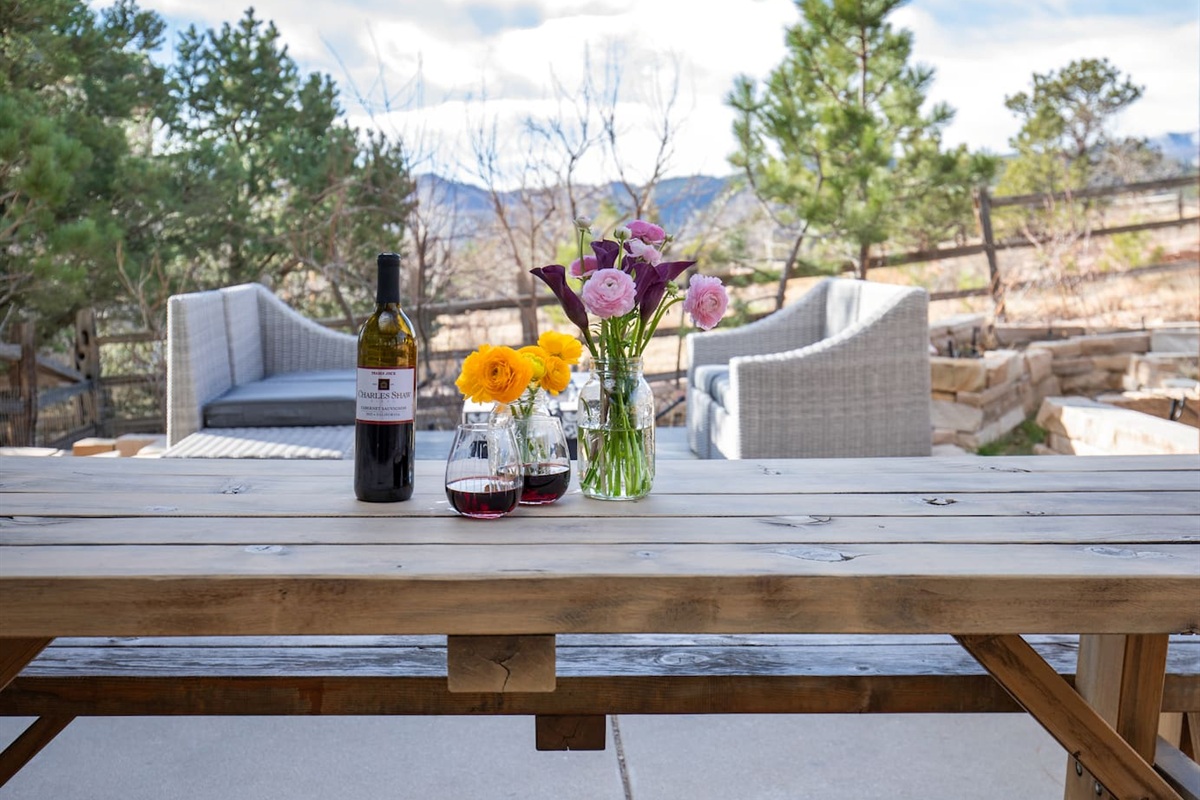 Enjoy meals al fresco at the backyard dining table, perfectly shaded under a charming pergola—ideal for morning coffee or evening dinners under the stars.”