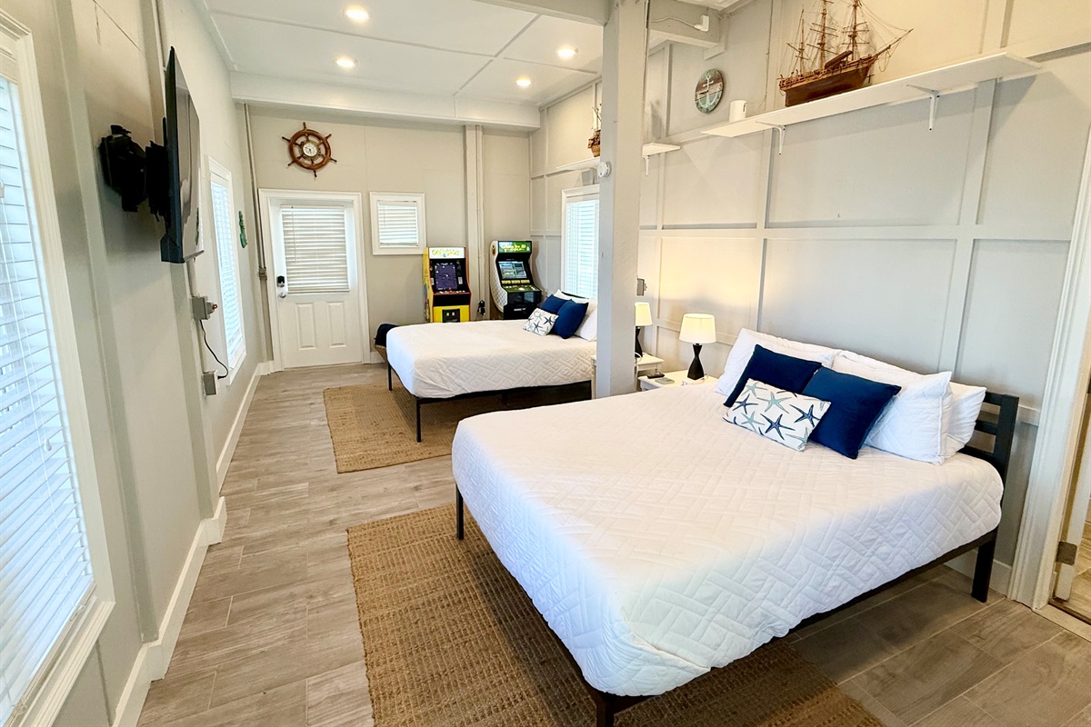 Fourth bedroom with 2 queen beds. Both have the highly rated 12 inch Zinus memory foam mattresses. Arcade games in this room as well.