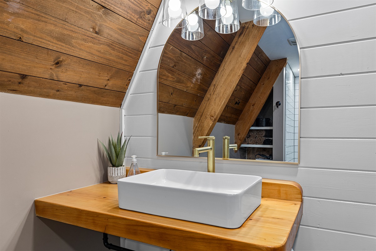 Form meets function with the cabin’s sleek vessel sink.