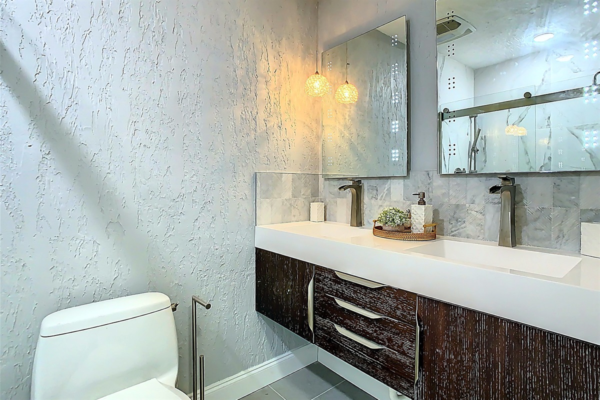 Spacious bathroom with large vanity, dual sinks and modern fixtures