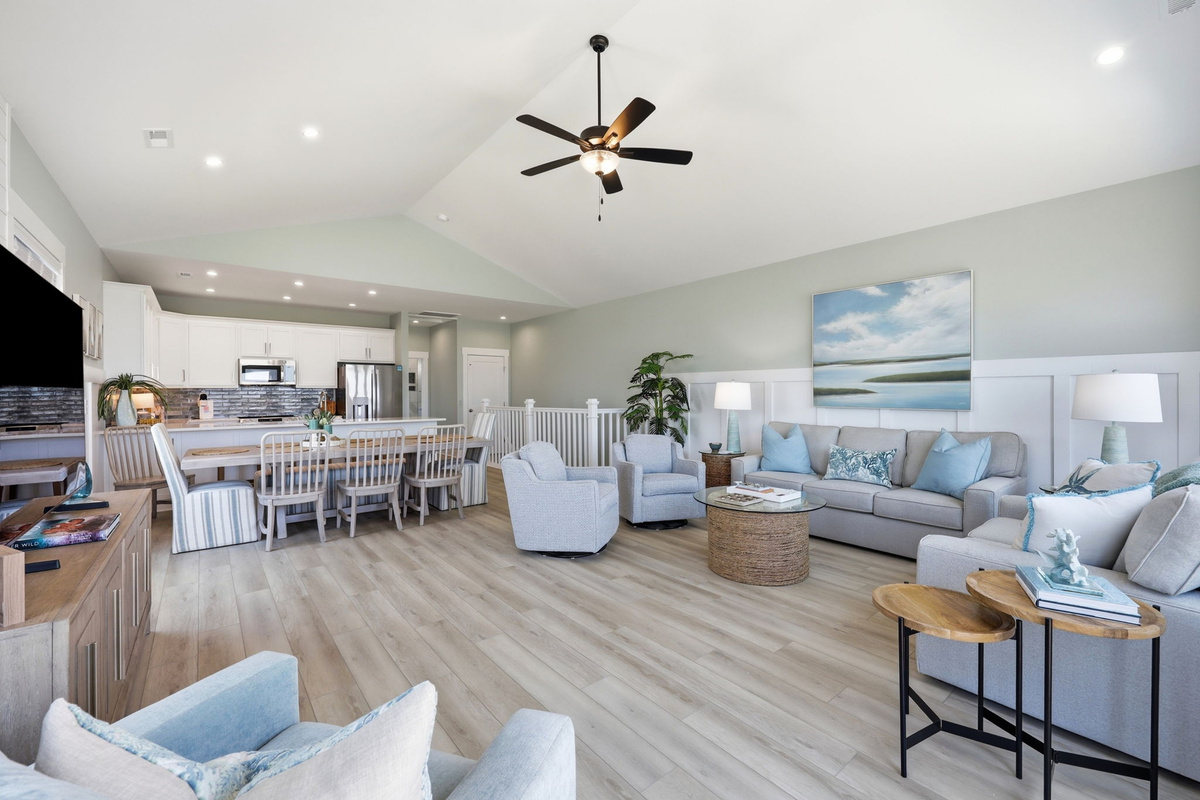 Coastal-inspired design and soaring ceilings create a bright, welcoming atmosphere