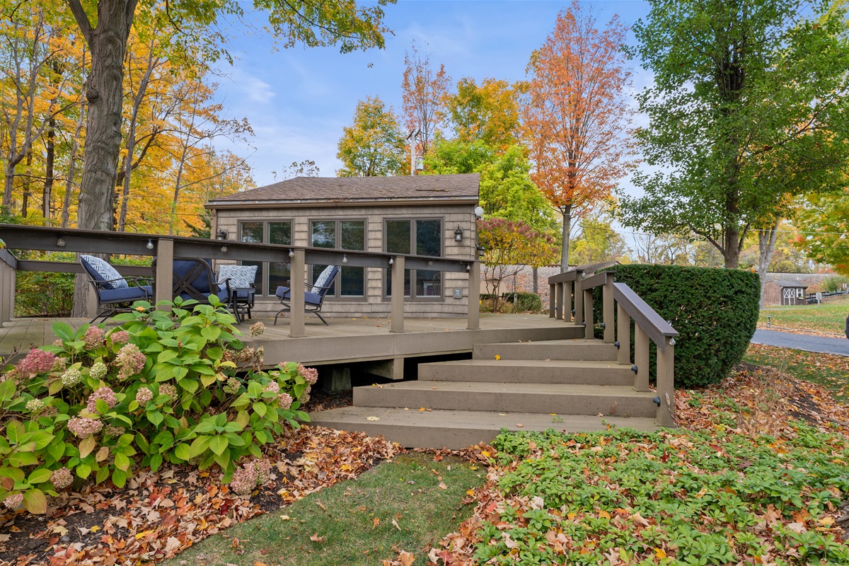 Charming lakeside cottage entrance surrounded by nature’s beauty