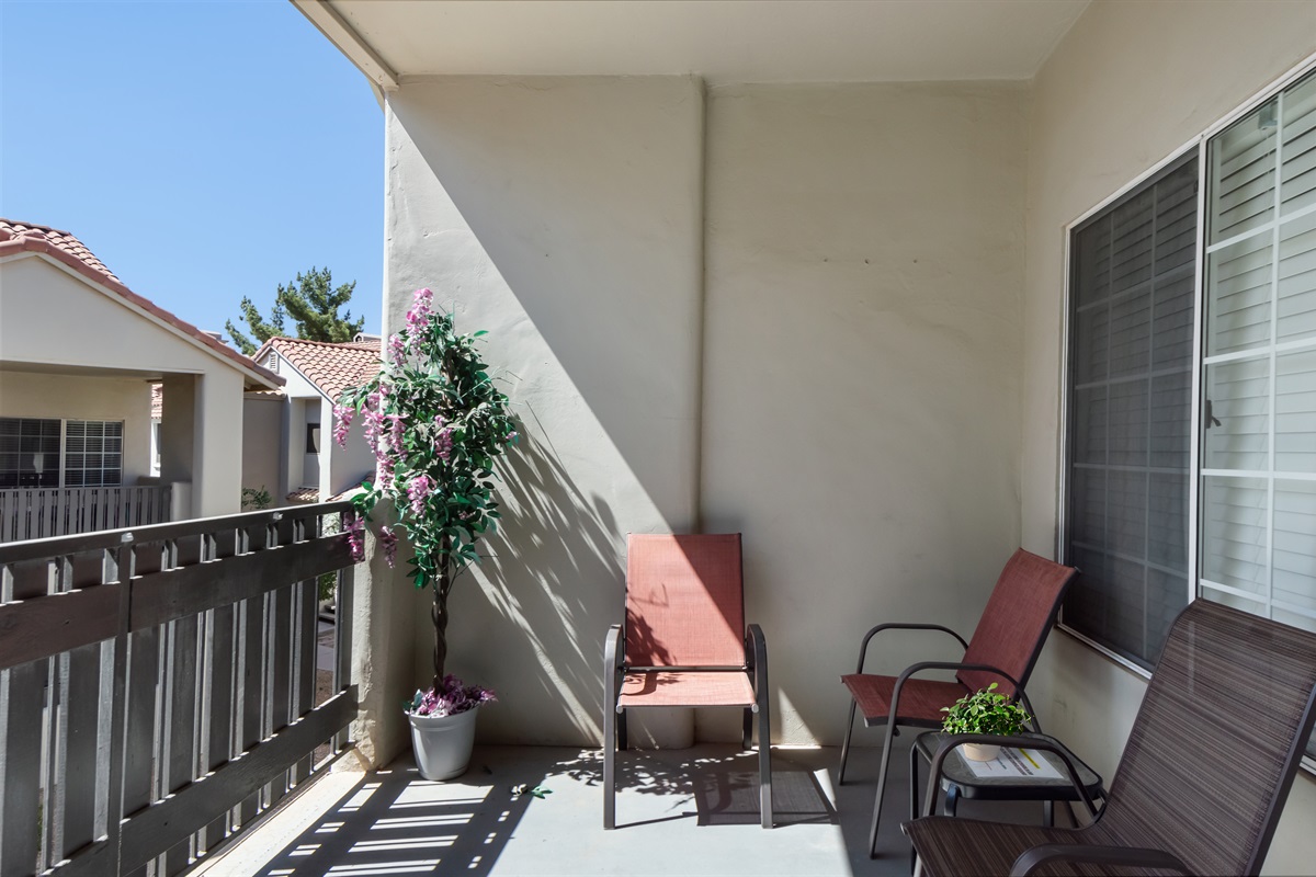 Spacious balcony/patio with comfortable seating and relaxing views