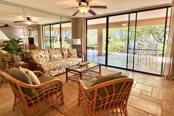 Relax in this living room on the comfortable chairs or couch, while looking outside. Easy access to the lanai.