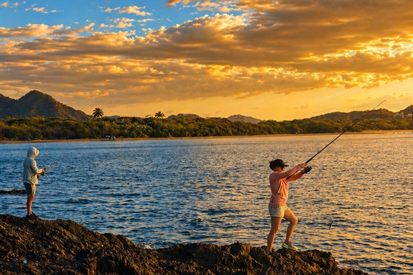 Fishing from the rocks by Villa