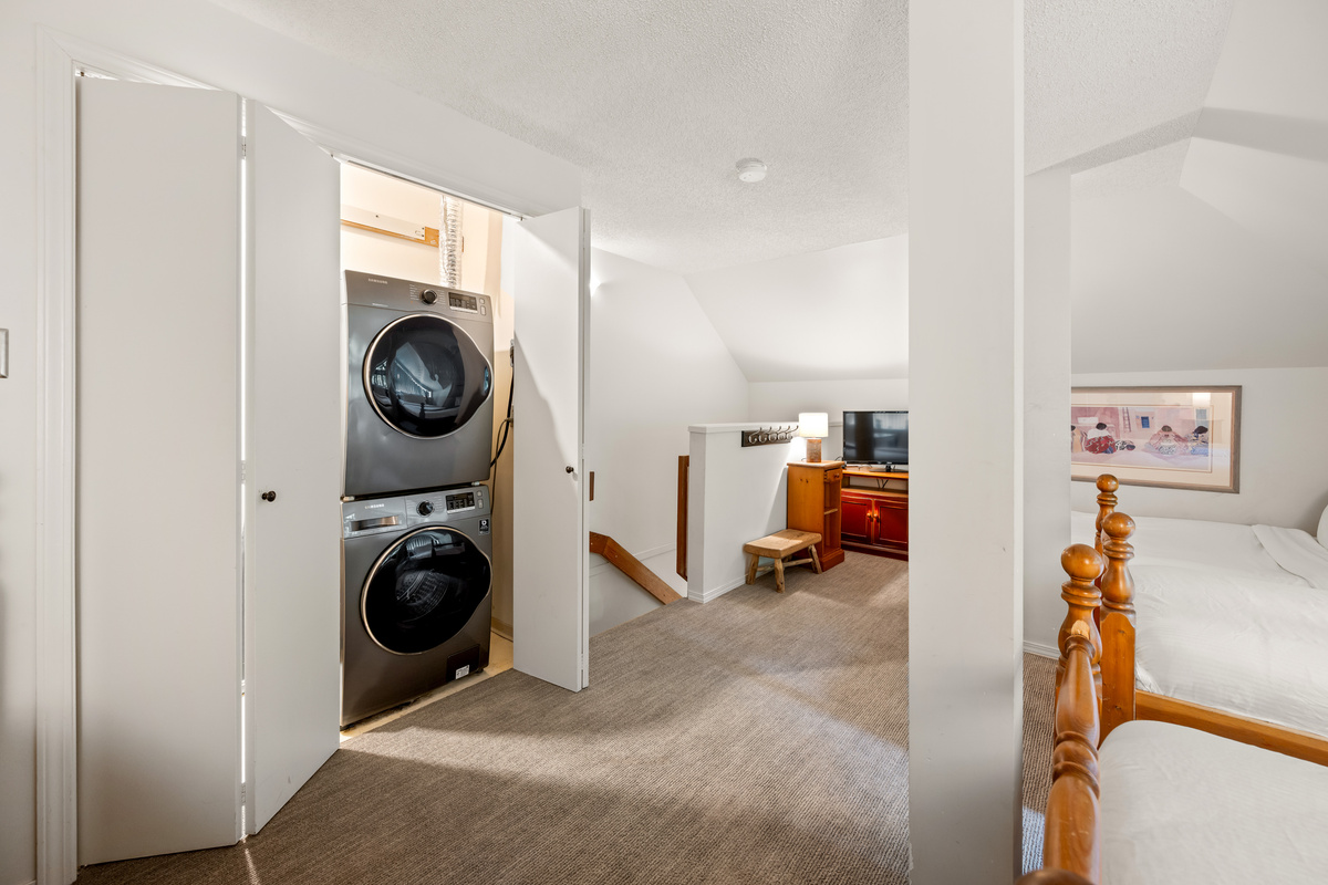 Stacked washer and dryer on the 3rd floor, next to the loft twins, for laundry during longer stays.