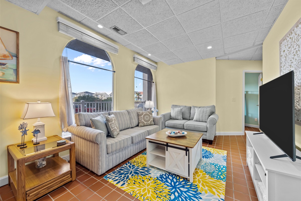 Bright, open living area designed for comfort and easy flow&mdash;perfect for relaxing together after a day at the beach