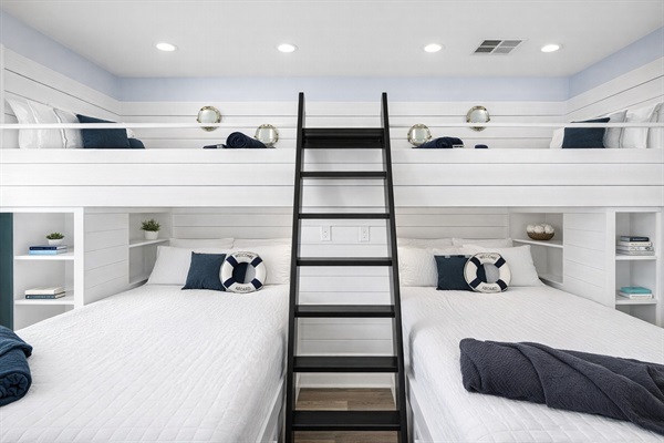 Bunk Room (Upper Level): Dual bunks and built-in shelving make this a fun group sleeping space.