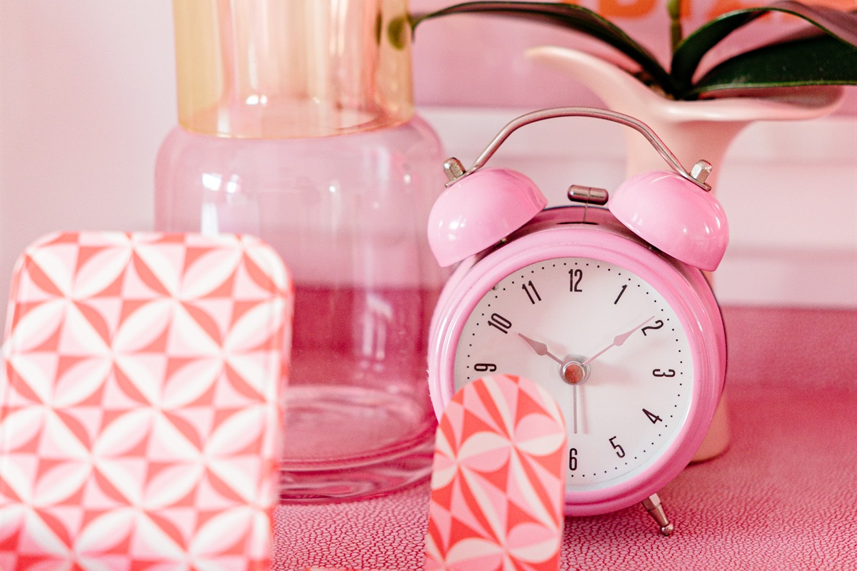 The second cottage bedroom is draped in themes of red and pink, a colorful and comfortable place to relax for a long evening's rest.