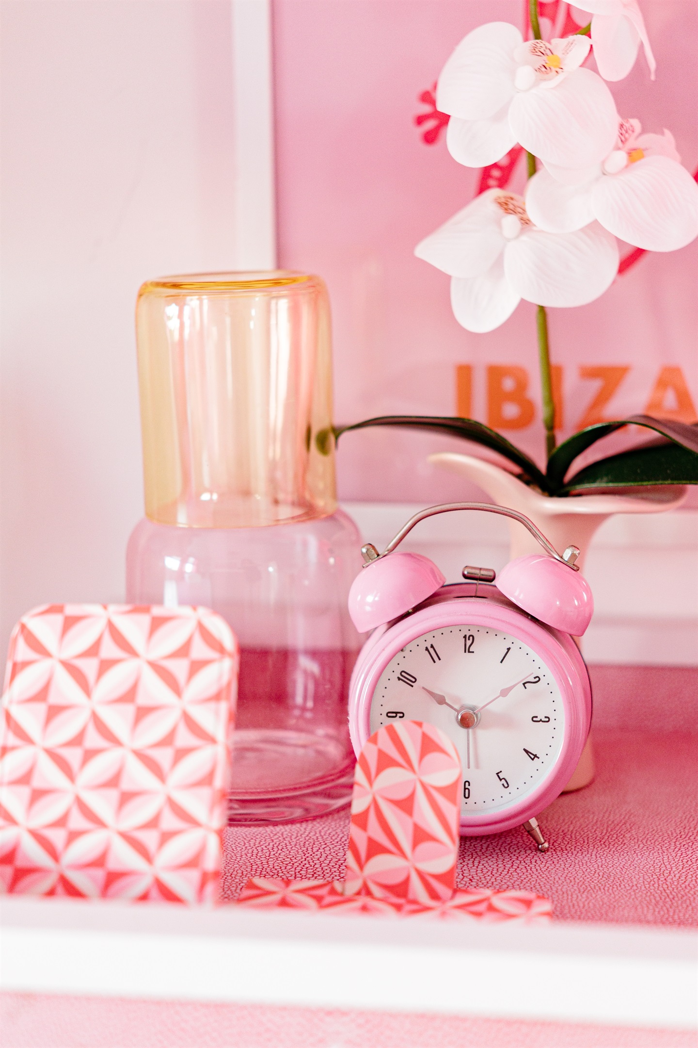 The second cottage bedroom is draped in themes of red and pink, a colorful and comfortable place to relax for a long evening's rest.