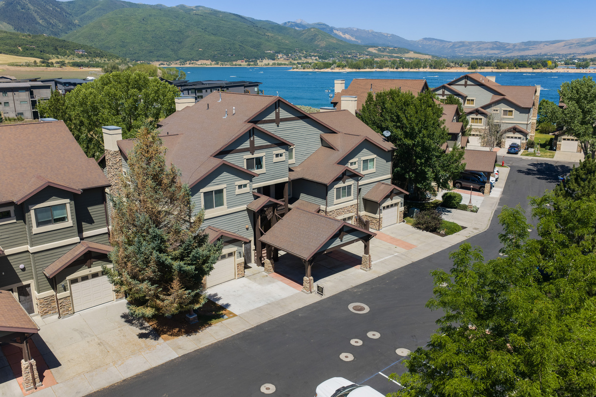 Neighborhood aerial highlighting the close proximity to the lake and surrounding mountains.