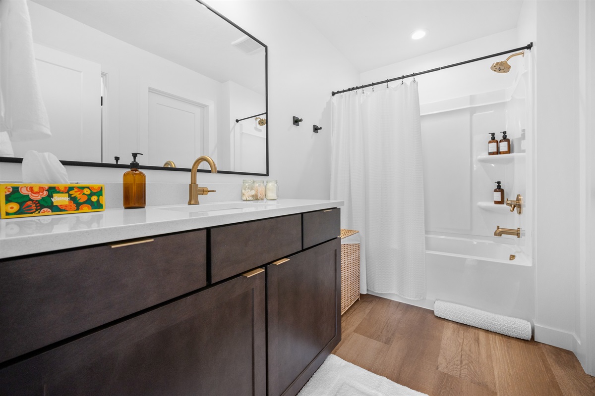 Spacious bathroom with double vanity and walk-in shower.