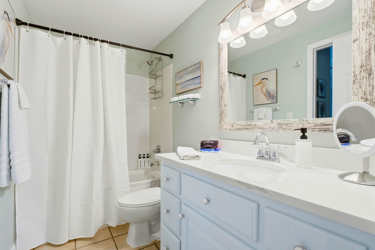 A spacious vanity and bright lighting make morning routines simple and stress-free during your stay.