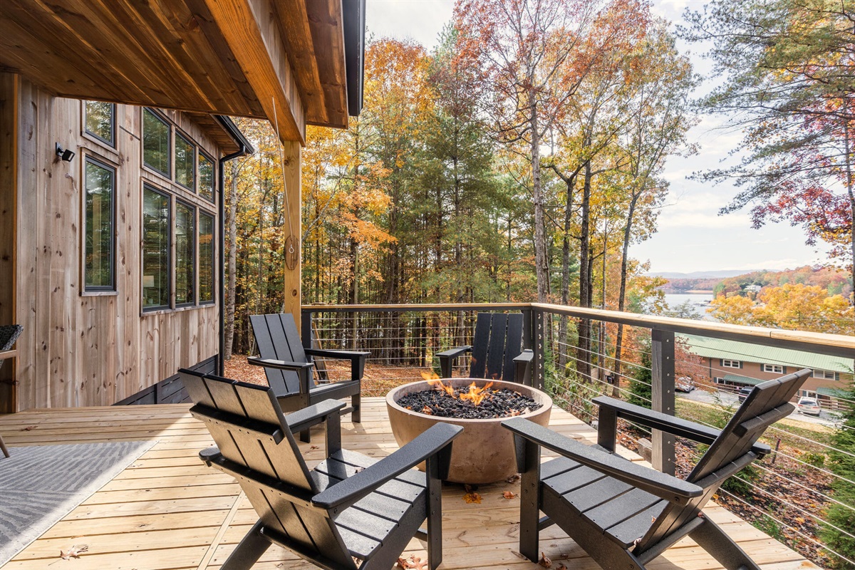 The fire pit area is the perfect spot to gather under the stars, with comfortable chairs and a tranquil forest setting.