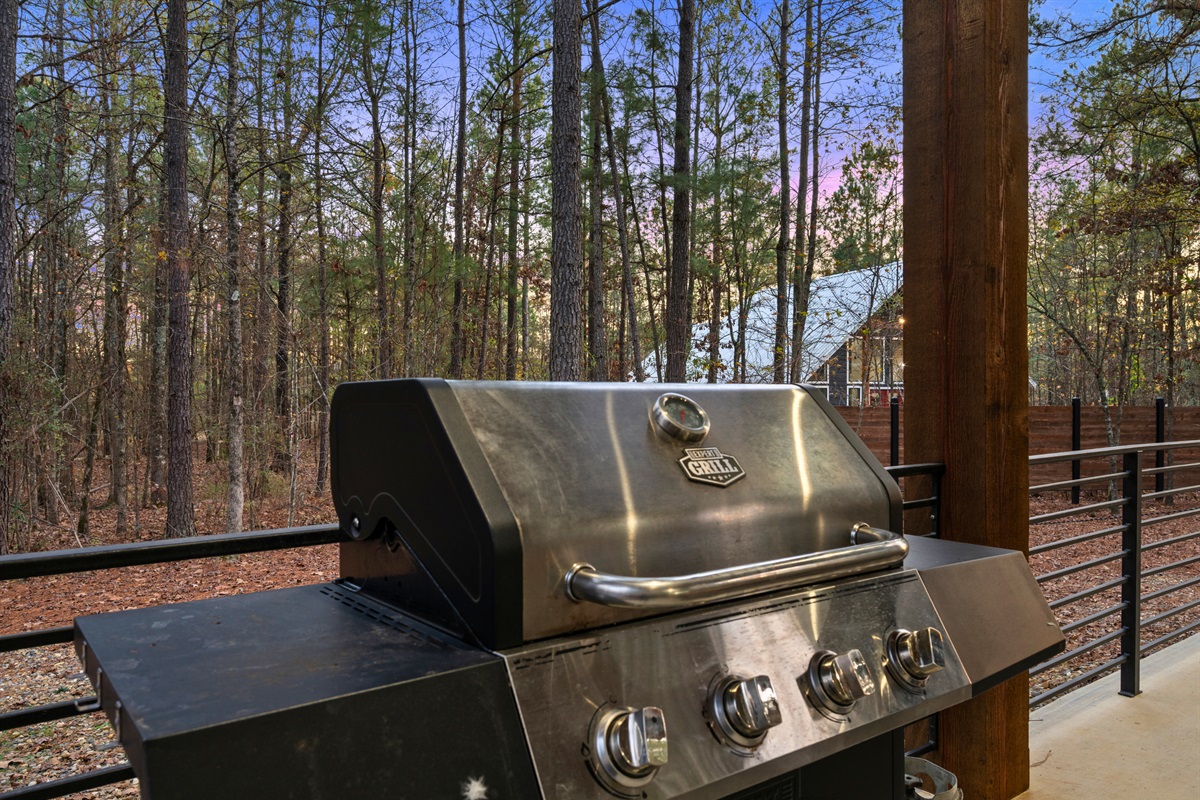 The grill is ready for laid-back cookouts, making it easy to enjoy meals in the fresh air.