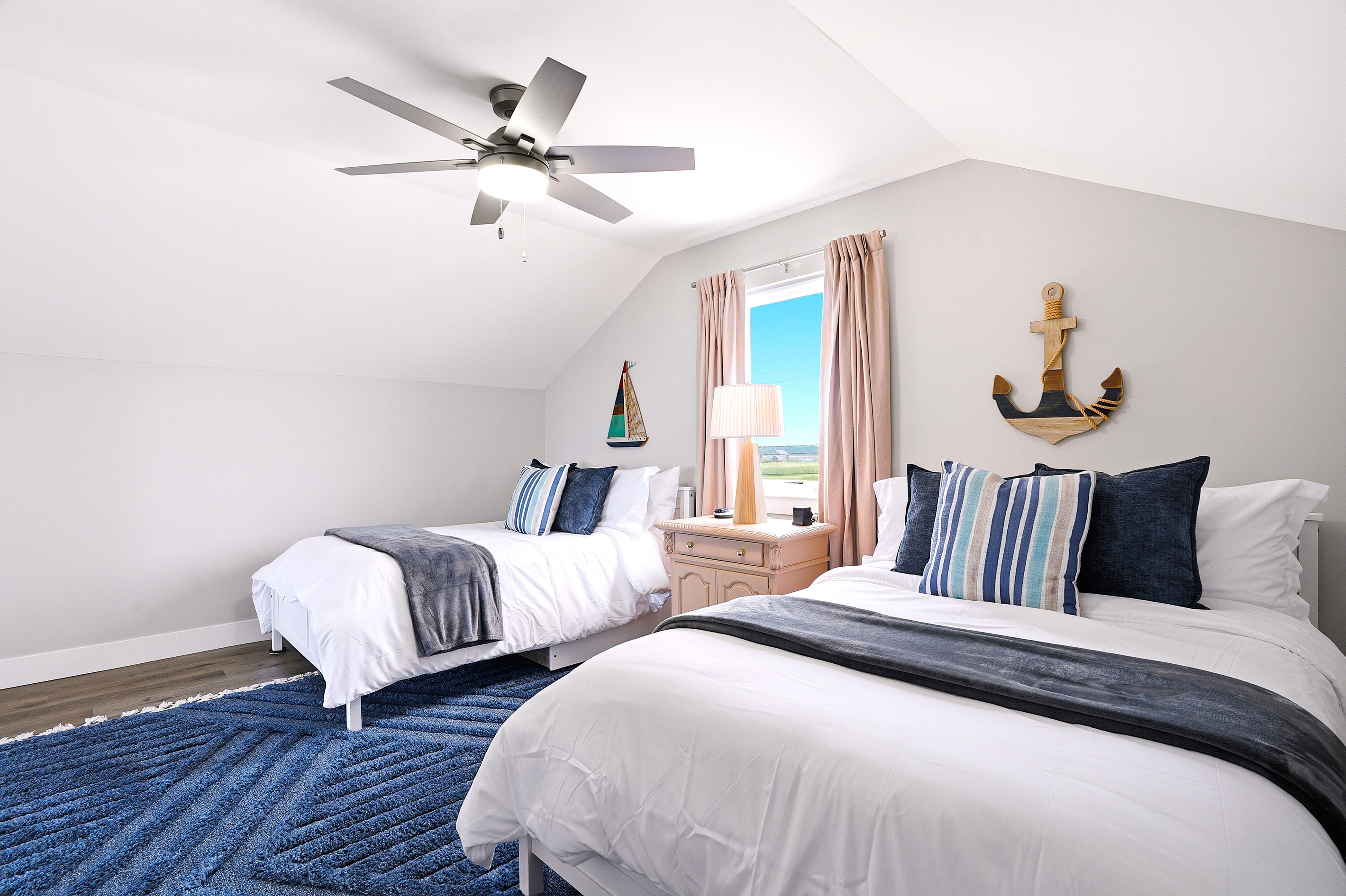 With a combination of queen and twin beds, this flexible sleeping space is ideal for kids, cousins, or friends traveling together while still giving everyone room to spread out.