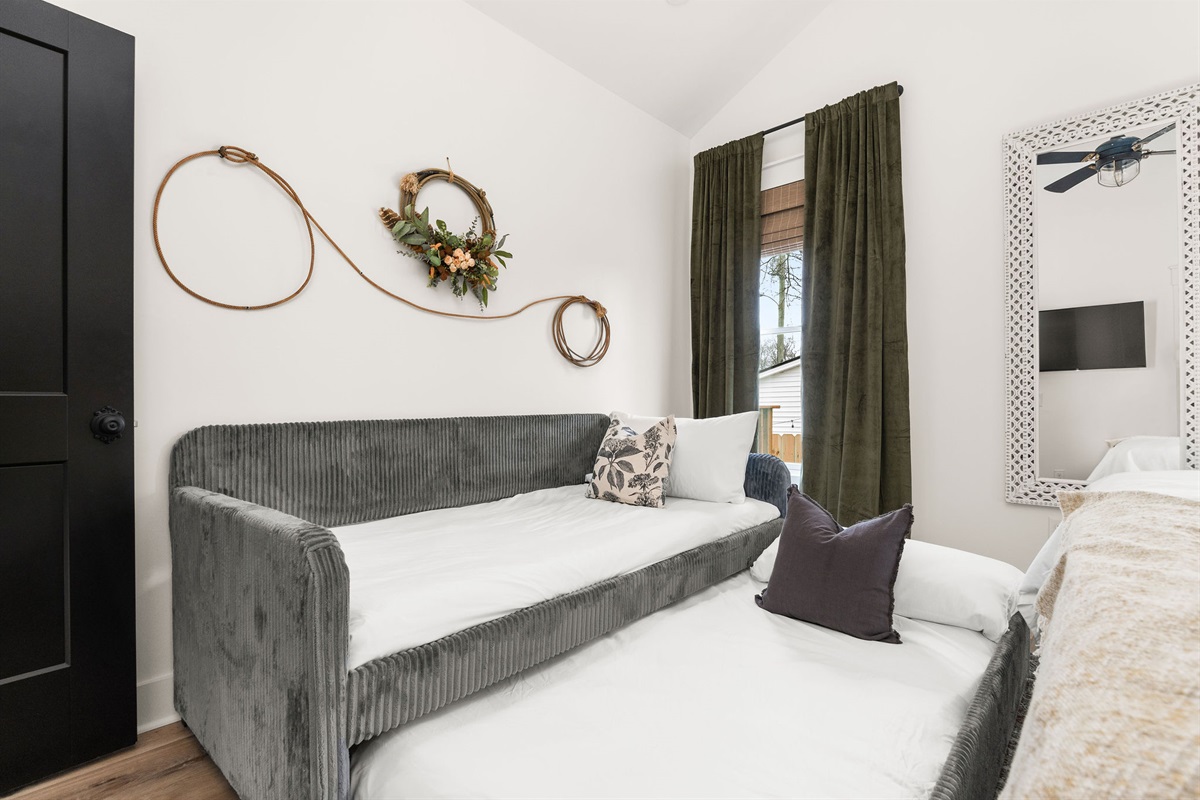 Primary Bedroom: Twin Daybed with Twin Trundle for Additional Guests.