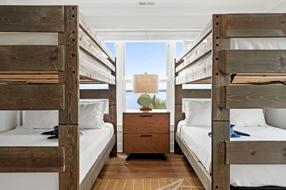 Spacious bunk room features two queen-over-queen bunk beds, perfect for kids and group stays