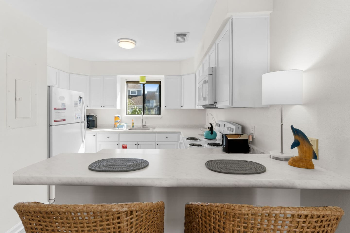 Pull up a stool at the kitchen bar &mdash; it's the easiest place for your first morning coffee before the day starts.