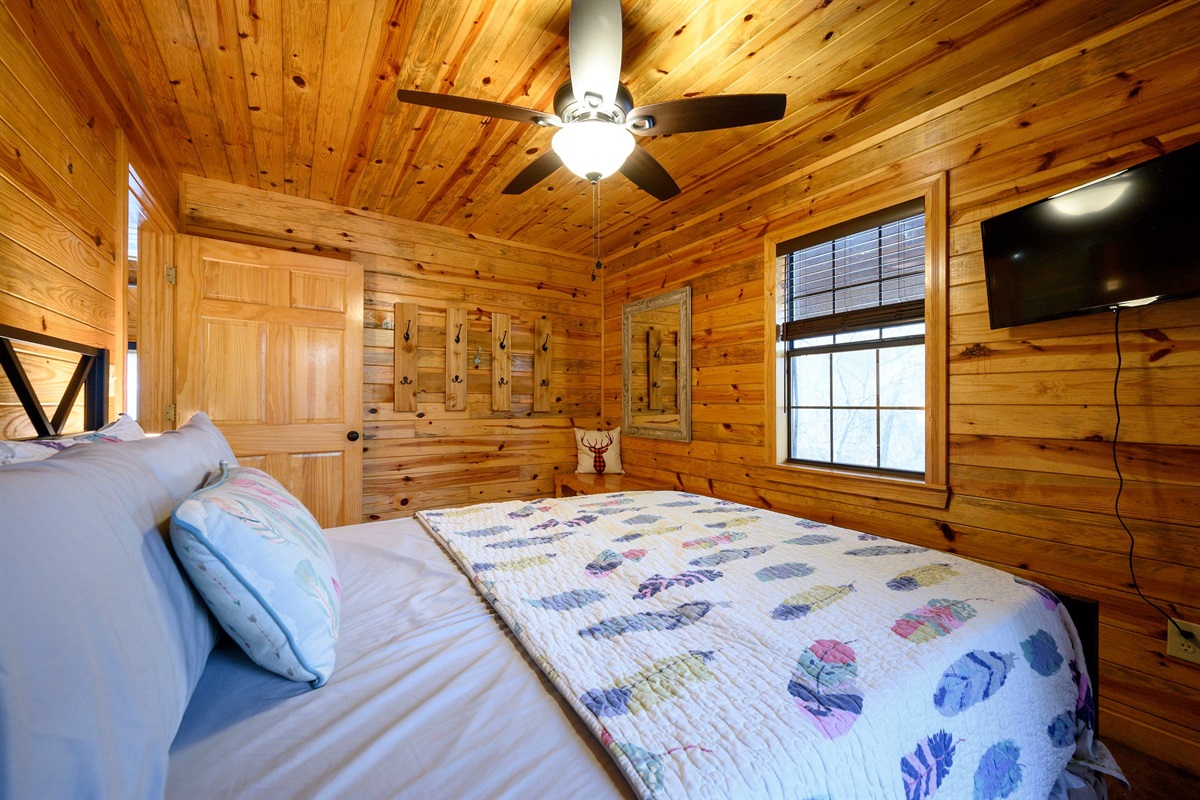 Main bedroom with TV and fan