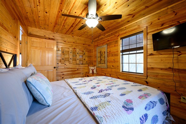 Main bedroom with TV and fan