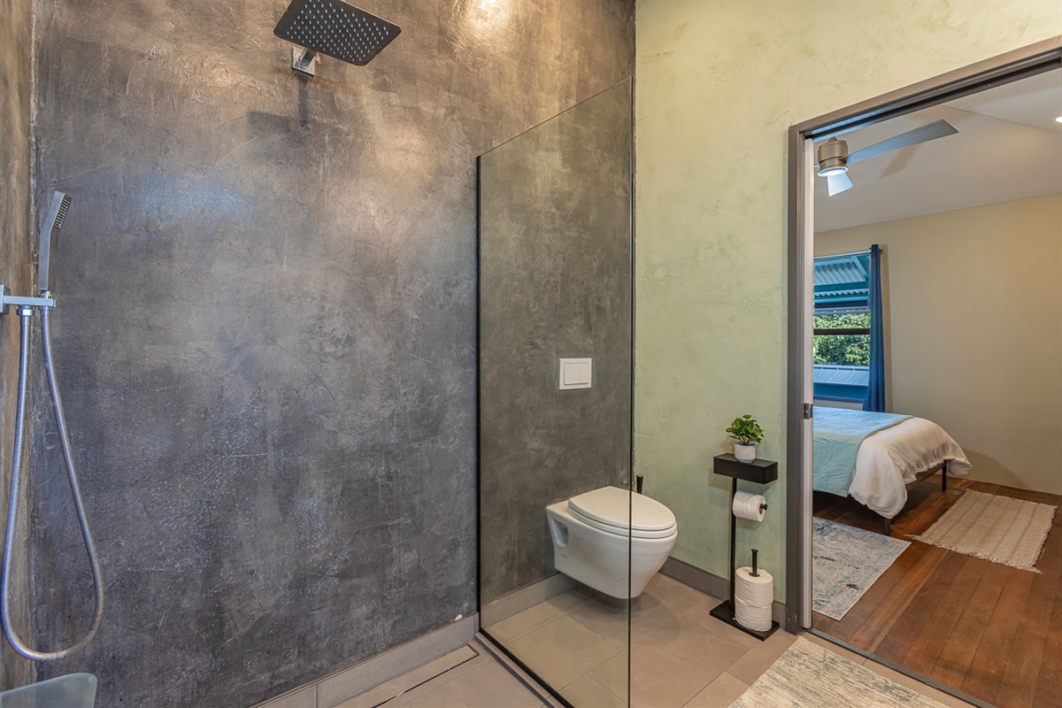 En suite bathroom in primary w/pocket door for privacy