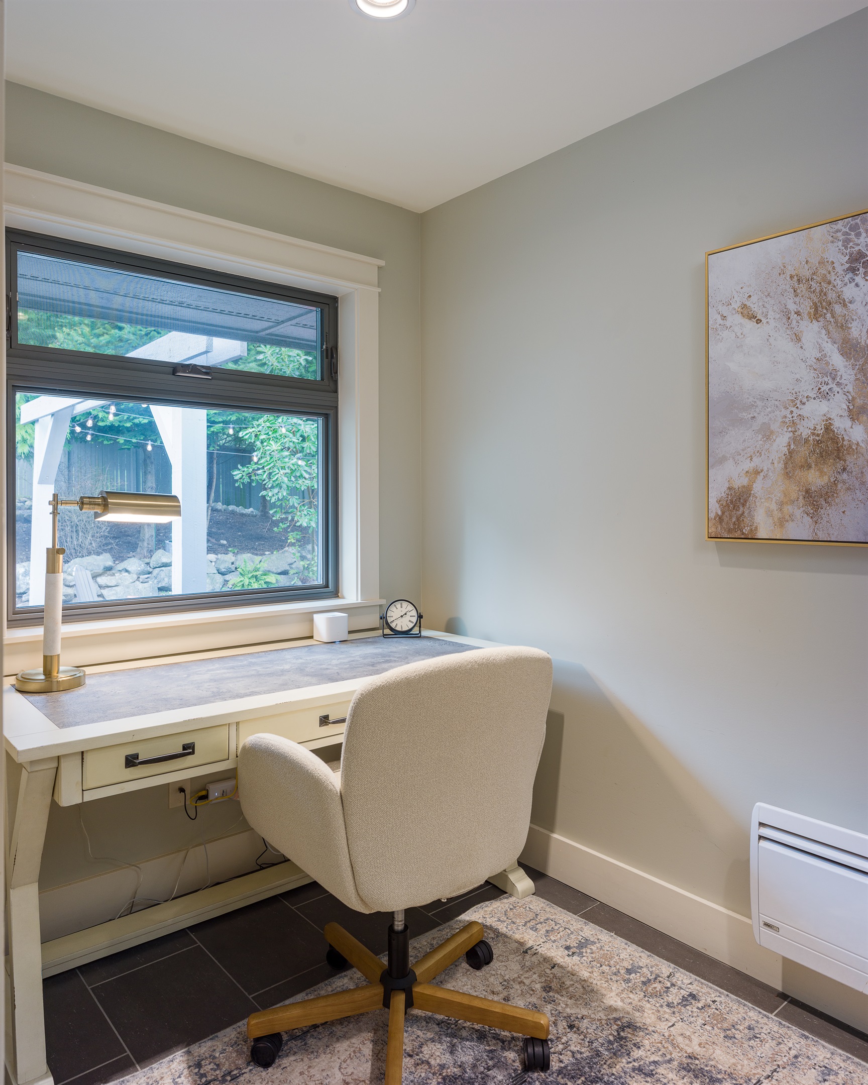 Work, write or relax in this office space with a view of the lush outdoor scenery.